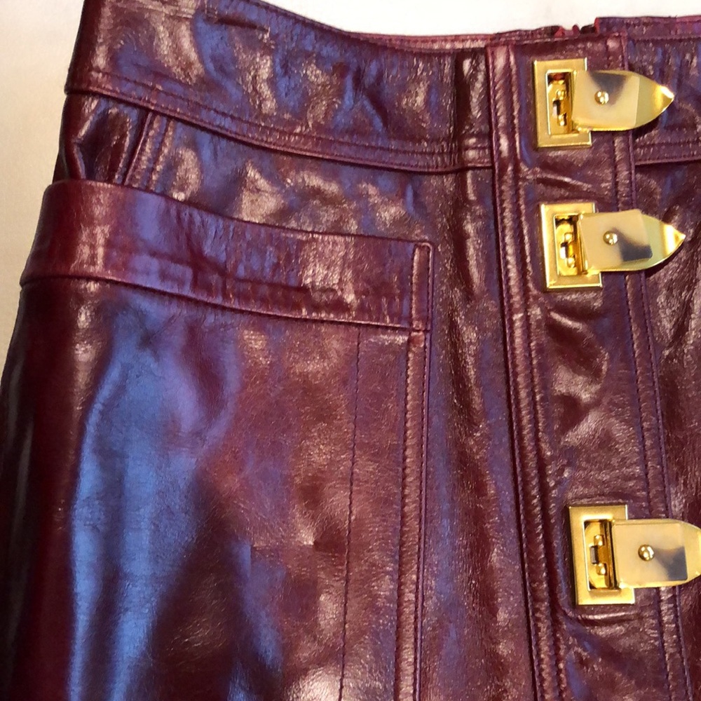 Tory Burch burgundy leather skirt with gold clasps on front - Picture 3 of 8